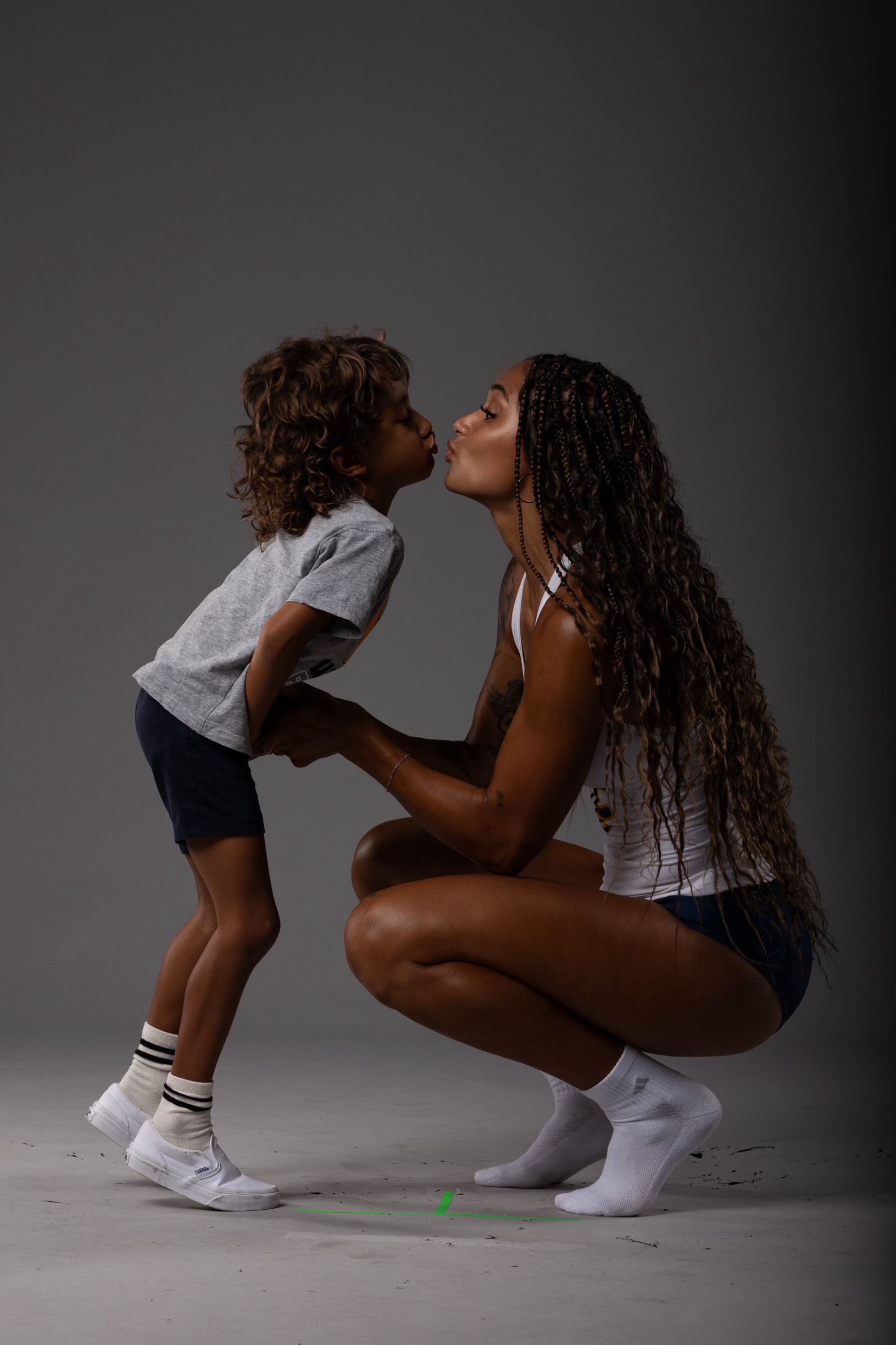 Jolie Robinson sharing a kiss with her son